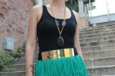 With black top, necklace and golden belt