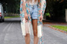 With denim shorts, brown lace up ankle boots and white top
