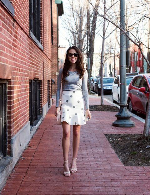 With gray long sleeved shirt, beige bag and white ankle strap shoes