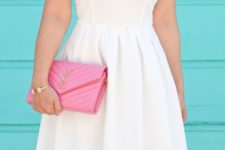 With pink leather clutch
