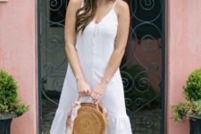 With straw rounded bag and beige mules