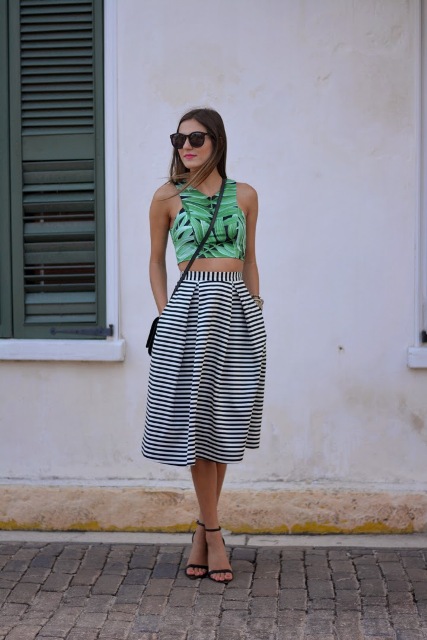 With striped high-waisted skirt, black crossbody bag and black high heels
