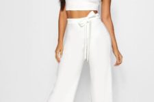 With white crop top and black sandals