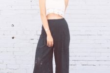 With white lace crop top, wide brim hat and cutout sandals