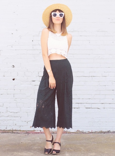 With white lace crop top, wide brim hat and cutout sandals