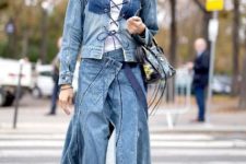 With white turtleneck, denim jacket, printed bag and black leather boots