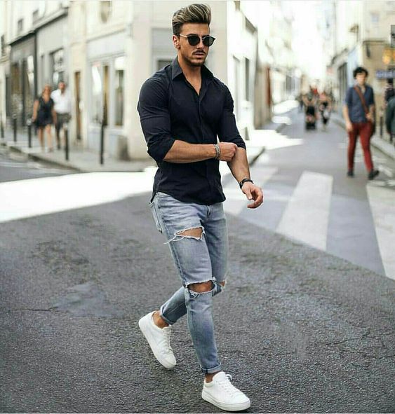 a black shirt, blue ripped skinnies, white sneakers are a timelessly cool combo