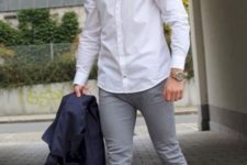 a white shirt, grey jeans, white sneakers for a simple everyday outfit during transitional time