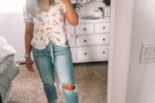 bleached ripped jeans with a floral shirt and comfortable wide strap sandals