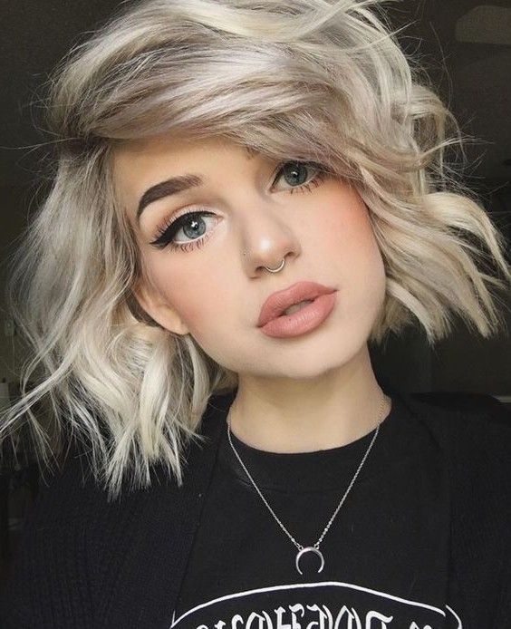 a messy short bob and a captive ring nose piercing make your look ultimate and super modern