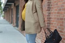 03 a mustard top, bleached jeans, a camel short coat, two toned shoes and a black bag