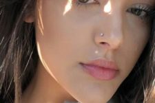 04 a simple stud nose piercing looks casual and chic and adds a touch of bling to your face