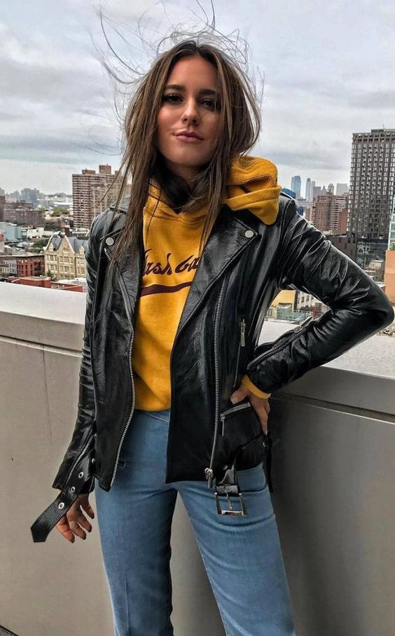 blue mom jeans, a yellow hoodie and a black leather jacket will give you a relaxed look