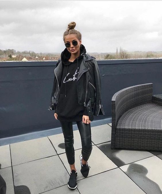 a total black look with leather leggings, sneakers, a hoodie and a leather jacket for the fall