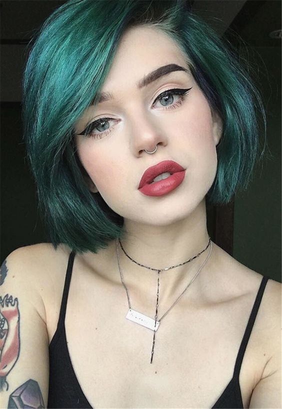 rocking green hair and a nose hoop piercing will add a statement rock touch to your look
