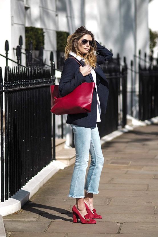 a white shirt, a black blazer, bleached jeans, a burgundy tote and matching heeled loafers
