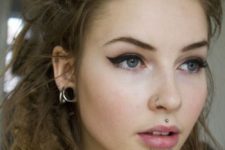 16 a chic nose ring and more piercings spruce up the look and make it rock