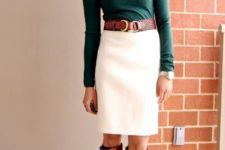 With emerald turtleneck, white skirt and brown leather high boots