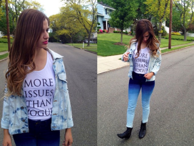 With labeled t-shirt, black boots and denim jacket