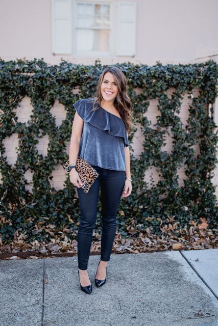 With skinny pants, black pumps and leopard clutch