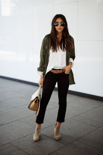 With white button down shirt, black cropped pants, gray suede ankle boots, olive green cardigan and bag
