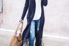 With white loose shirt, distressed jeans, beige bag and beige cutout boots