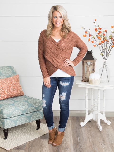 With white shirt, distressed jeans and brown suede cutout boots