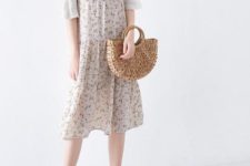 With white shirt, floral dress and beige shoes