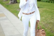 With white t-shirt, blazer, cuffed pants, beige bag and white and brown sandals