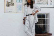 With white t-shirt, wide brim hat, black belt and white mules