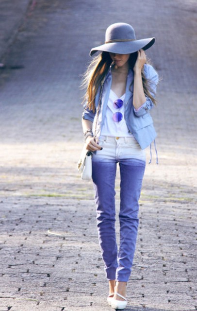 With wide brim hat, white bag, white top, blue jacket and white heels