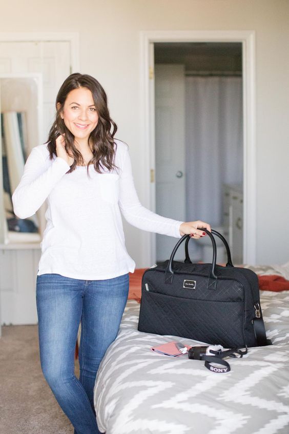 a black travel bag like this one allows to put a lot inside and will fit most of your outfits