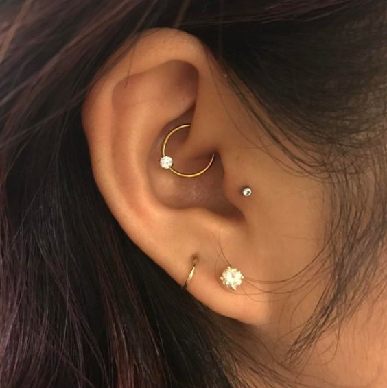 a chic setup with rhinestones and hoops including a rhinestone hoop in the daith