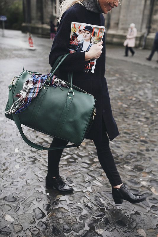a dark green weekender bag will add a touch of color and will make your look cooler