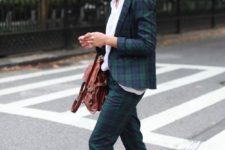 a dark plaid pantsuit, a white shirt to refresh the look, snake print loafers and a brown bag