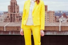a sunny yellow pantsuit, a neutral shirt and polka dot shoes will raise your mood at once