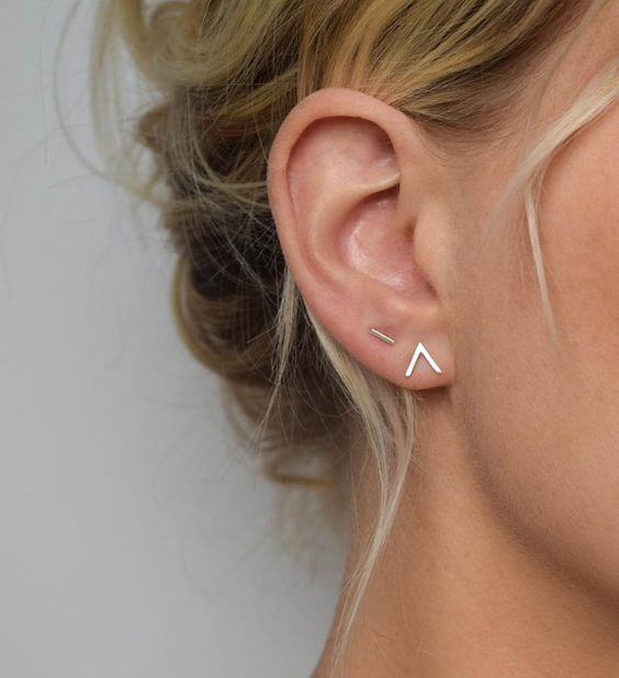 a duo of minimalist studs   a triangle and a line are a great idea for a stylish look
