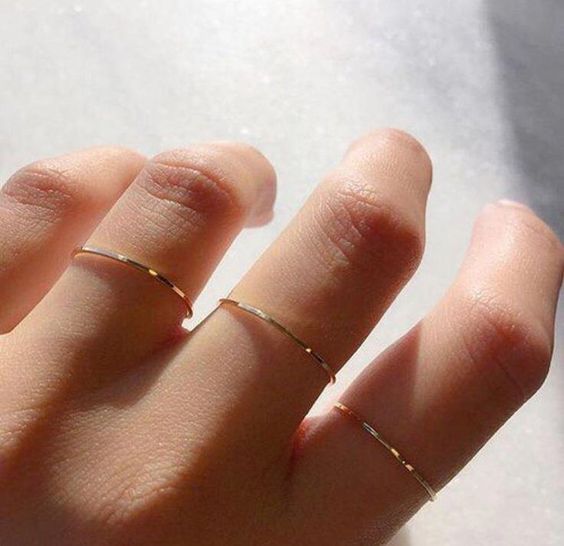very tiny and thin gold rings to accessorize your hands right