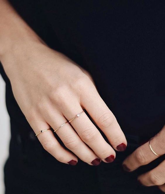 minimalist gold and diamond rings on each finger is a gorgeous minimalist jewelry idea