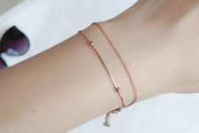 08 a rose gold chain bracelet with tiny beads  and a little coin is a stylish minimalist idea