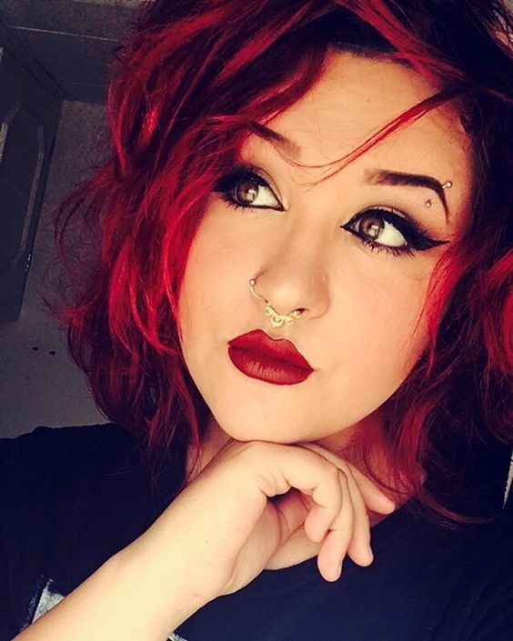 an eyebrow and double nose piercing will make you stand out a lot anywhere