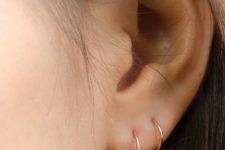 11 a duo of tiny gold hoops are a nice and stylish minimalist idea to accessorize your ears
