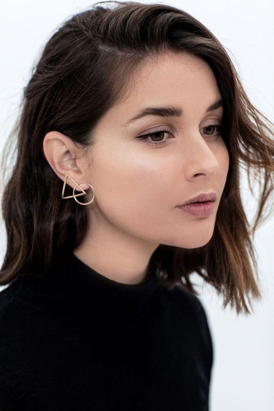 a gorgeous geometric earring of a circle and a triangle is a stylish idea to accesorize your look