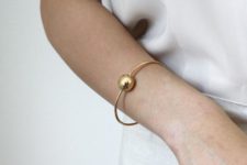 14 a minimalist gold bracelet with a large bead is a cool idea to make your minimalist outfit more statement-like