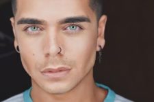 14 men ear and nose piercing with all different hoops and earrings for a bold touch