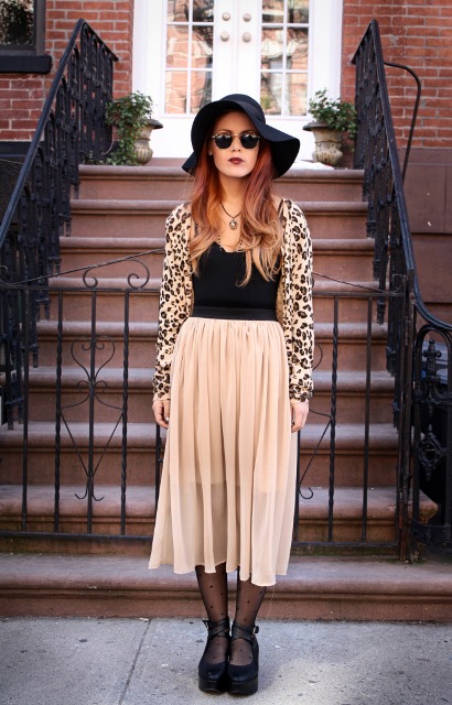 With airy skirt, wide brim hat, platform shoes and black top