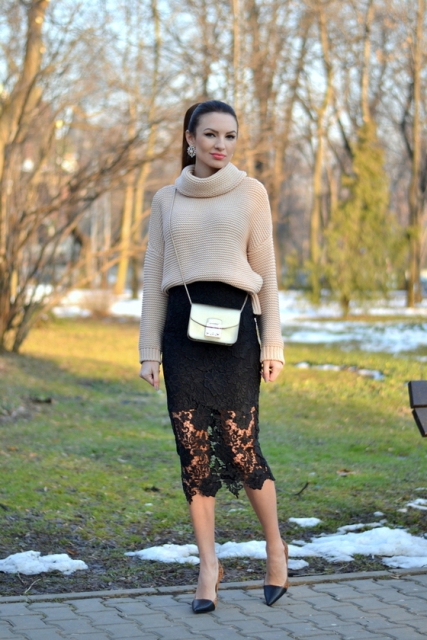 With beige sweater, silver bag and black and brown shoes