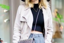 With black crop top, gray trench coat, printed chain strap bag and gray trousers