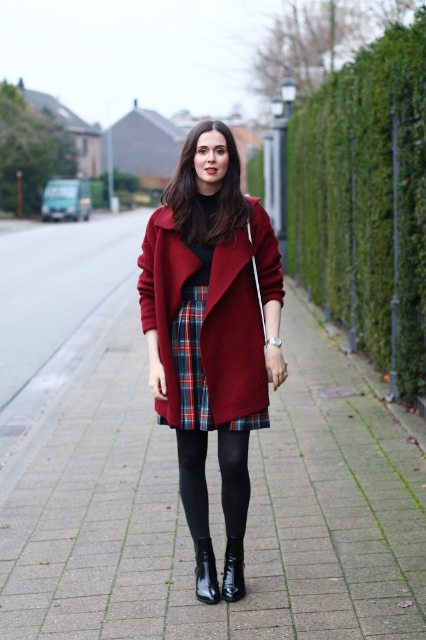 With black shirt, marsala coat, white bag and black patent leather ankle boots