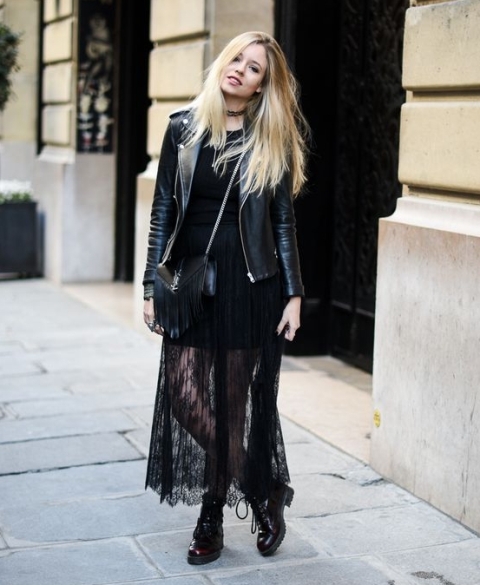 With black top, black leather jacket, chain strap bag and black lace up boots